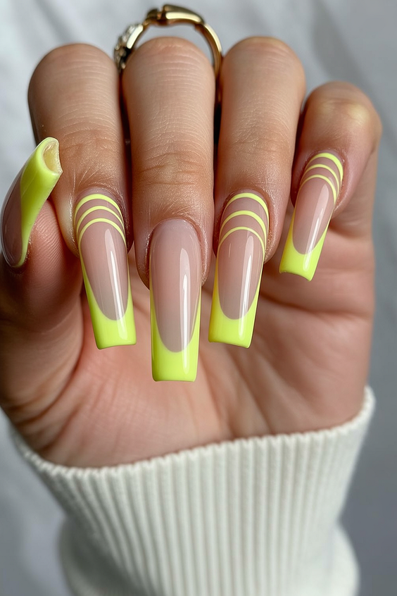 Long square nails with neon stripes.