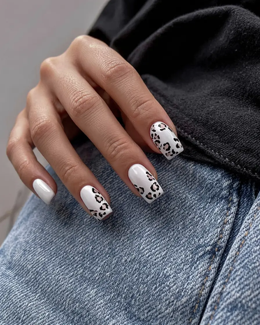 Short square nails with leopard print accents.