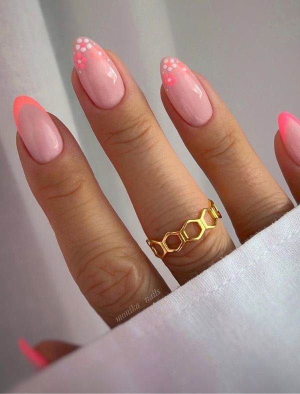 Almond nails with neon tips and polka dots.