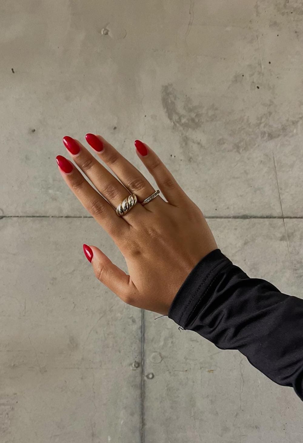 Medium almond nails in bold red polish.