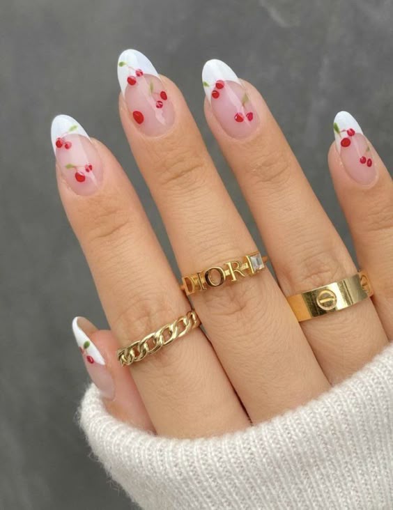 Cherry-themed French nails, perfect for playful vacation looks and fun designs