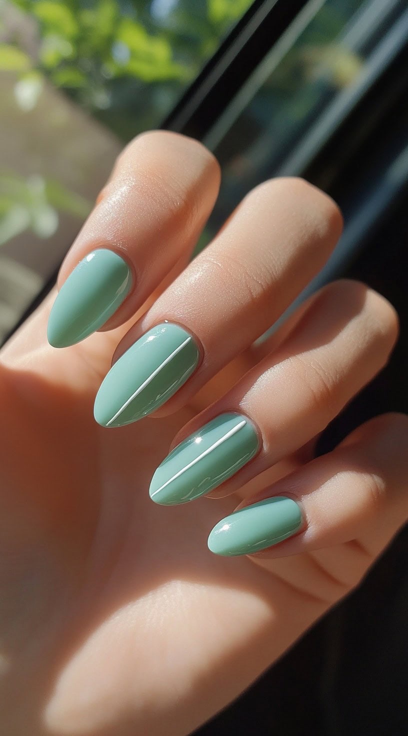 Sage green nails, perfect for natural vacation looks and understated elegance