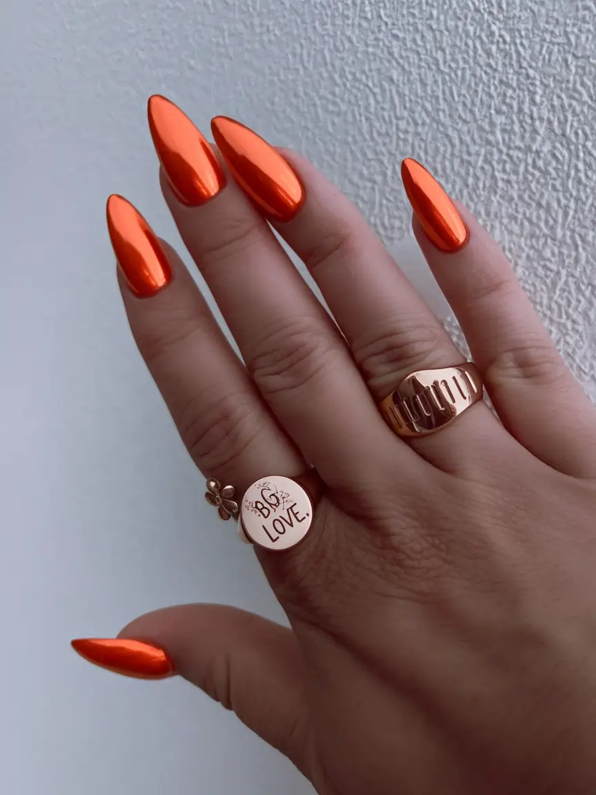 Vibrant orange nails, suitable for bold vacation styles