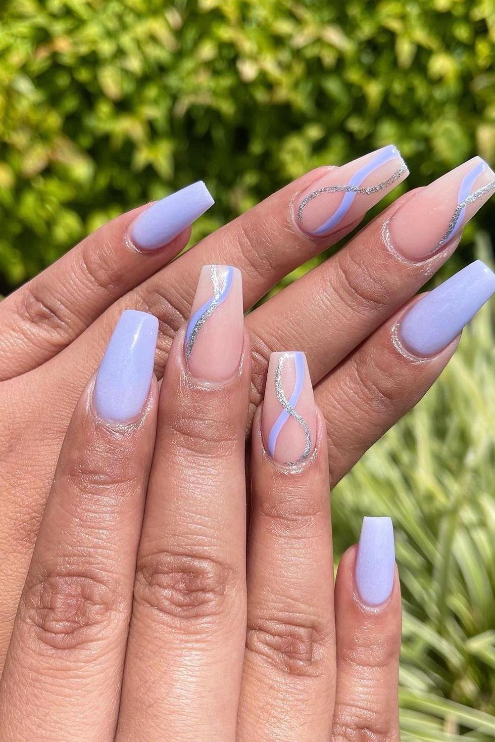 Lavender nails with silver accents, perfect for elegant vacation styles