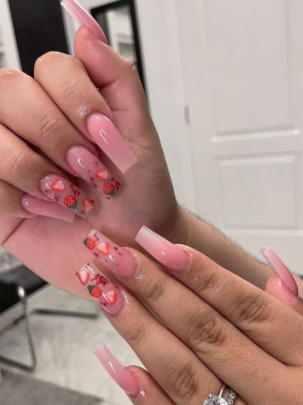 Strawberry-themed nails, ideal for sweet and playful vacation styles