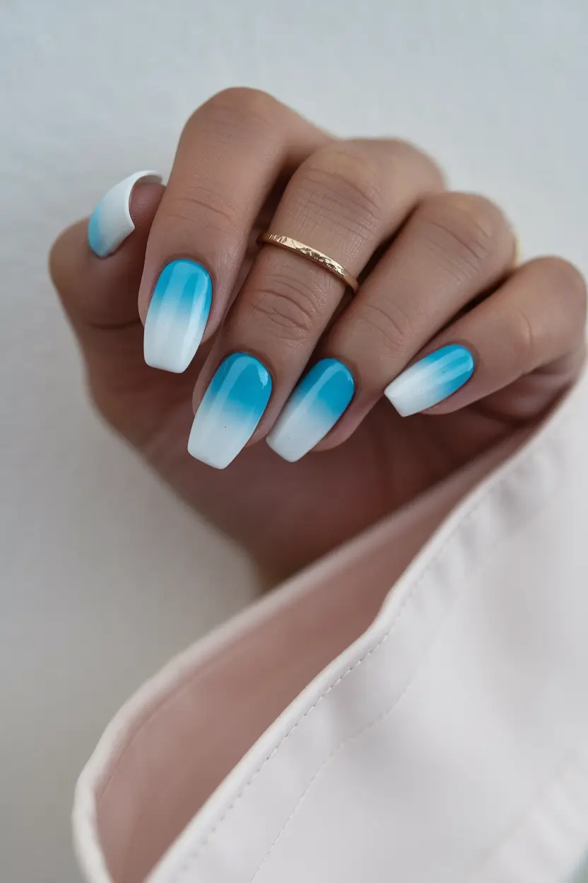 Blue ombre nails, perfect for serene vacation styles