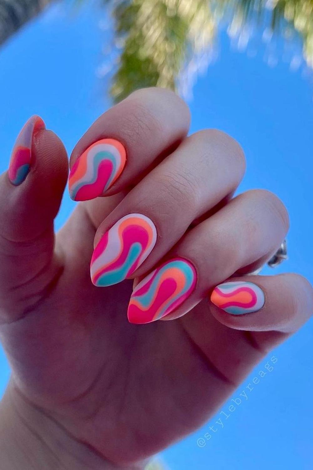 Neon swirl nails, perfect for retro-inspired vacation styles