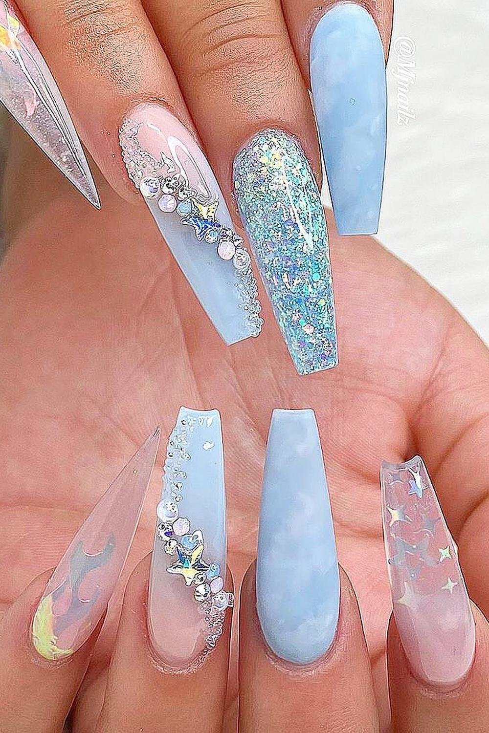 Blue embellished nails, ideal for luxurious vacation styles