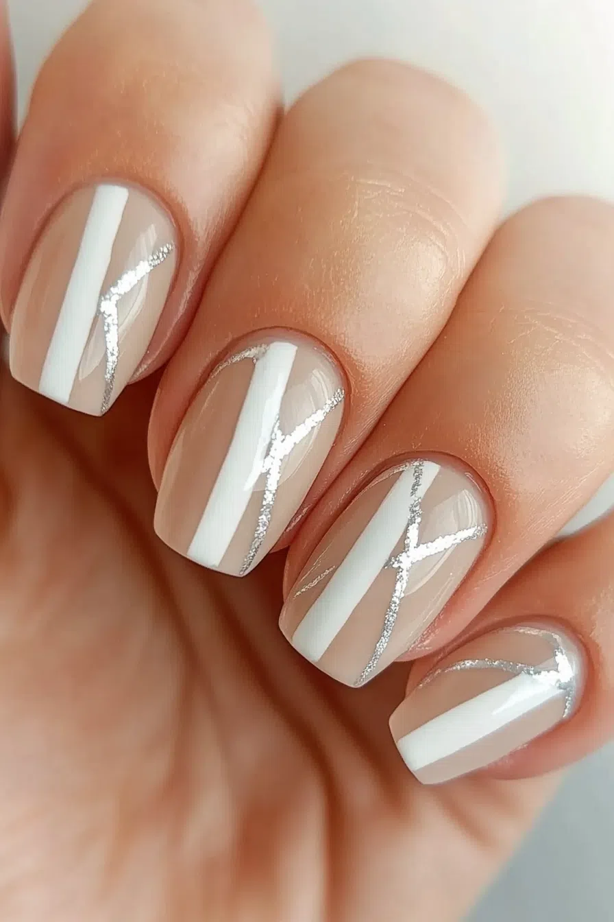 Nude nails with white and silver stripes, modern elegance