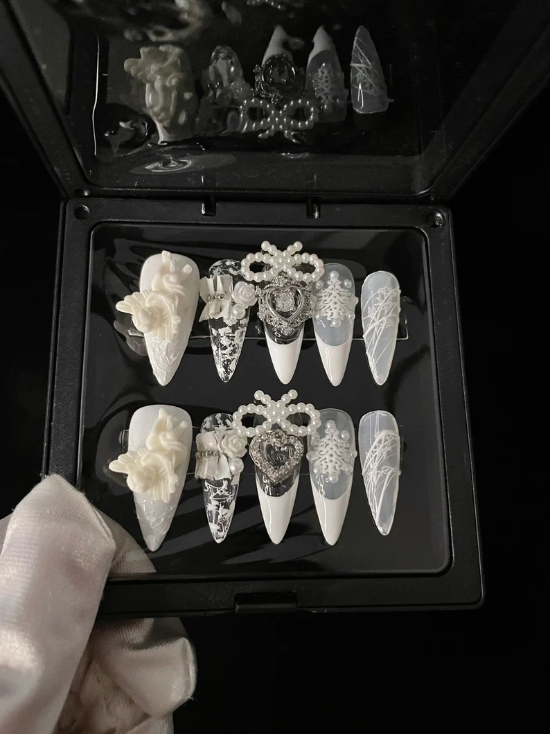 Intricate white wedding nails, statement style