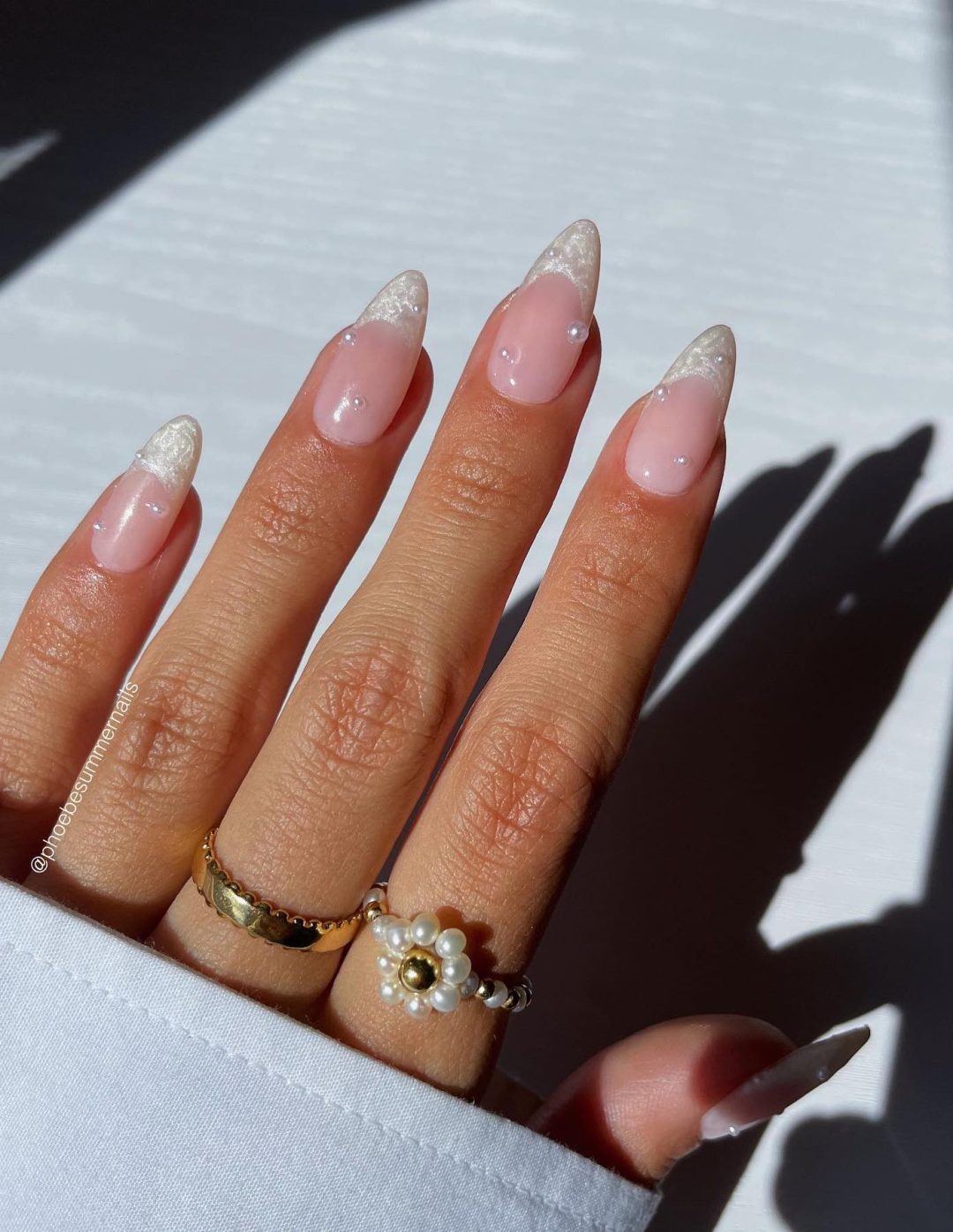 Soft pink nails with delicate designs, bridal choice