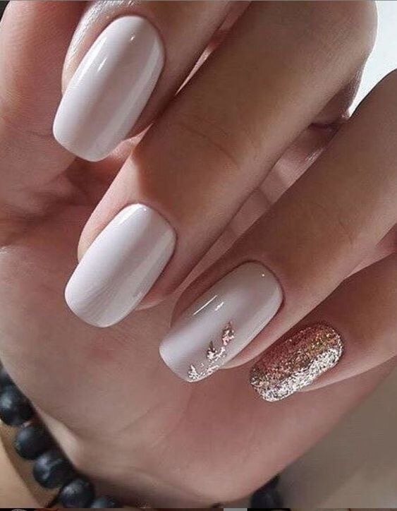 Neutral nails with glam accents, elegant bridal choice