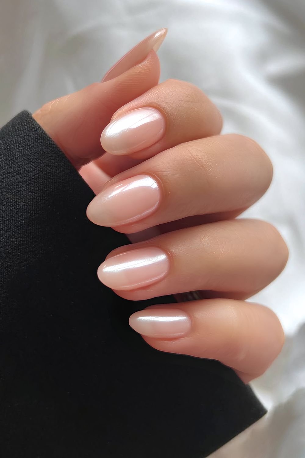 Almond-shaped nails with pearlescent finish, elegant wedding nails.