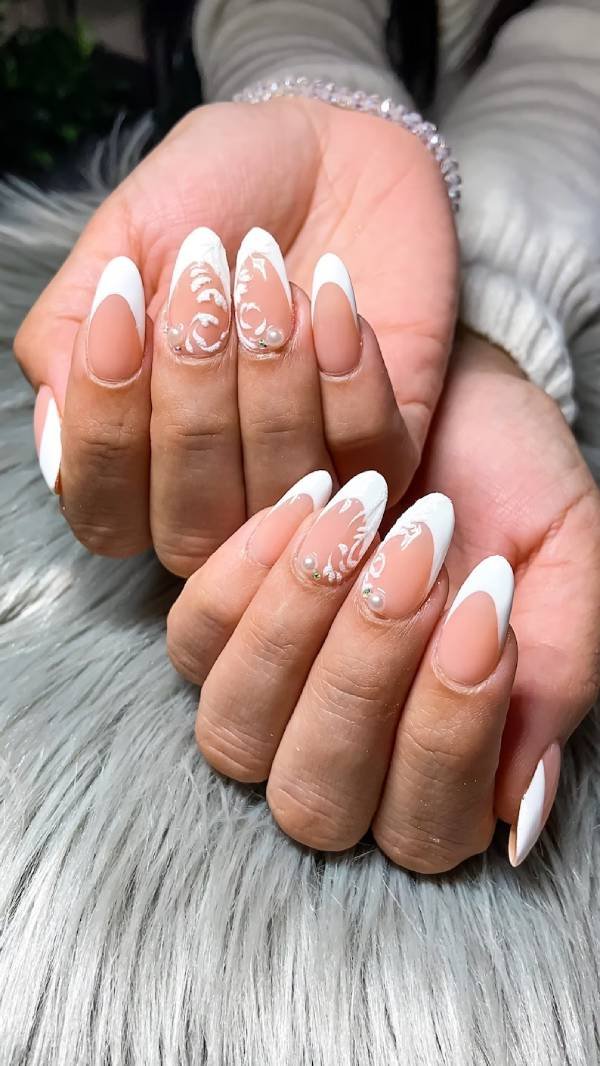 French manicure with baroque details and pearls, elegant wedding nails.