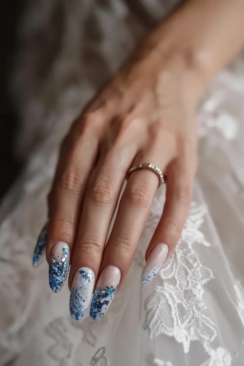 Medium nails with blue floral design, romantic wedding style.