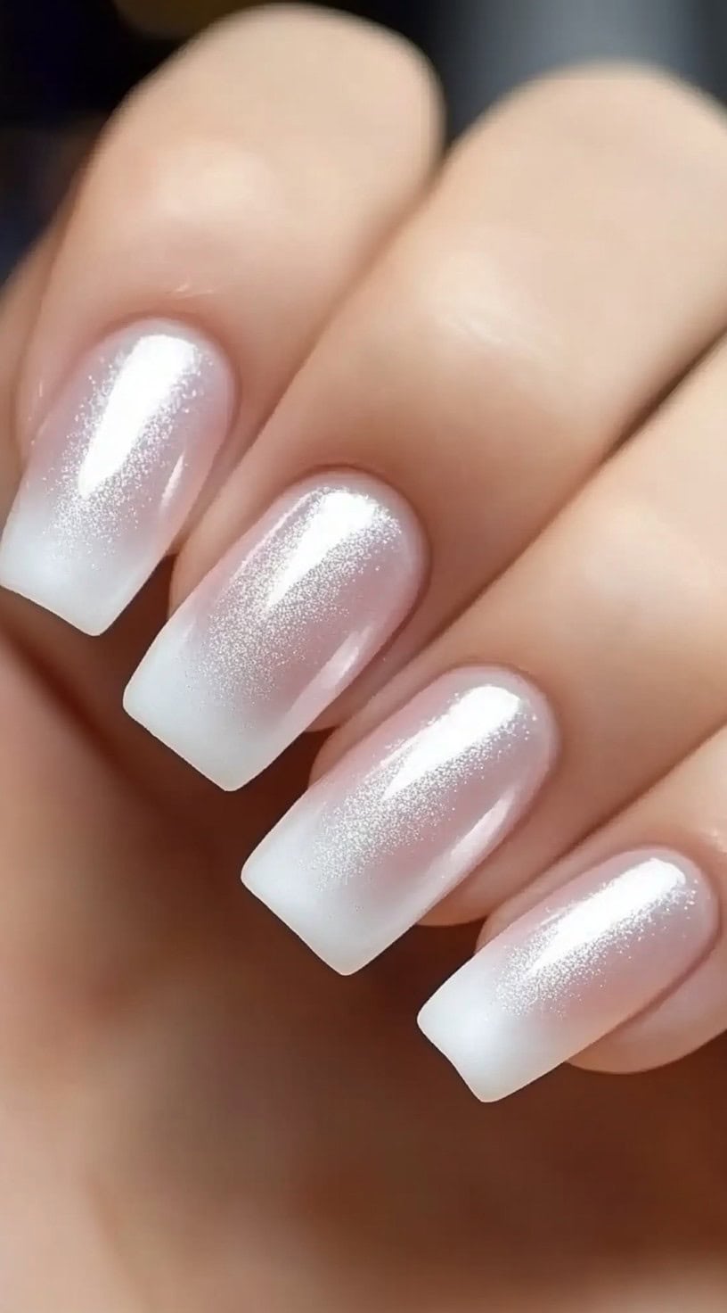 Square nails with shimmering ombre, elegant and soft.