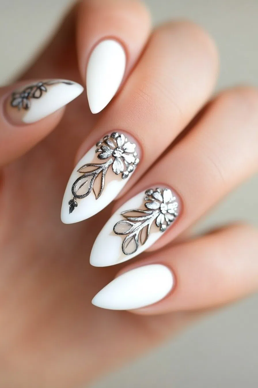 Almond nails with white floral art, elegant bridal design.