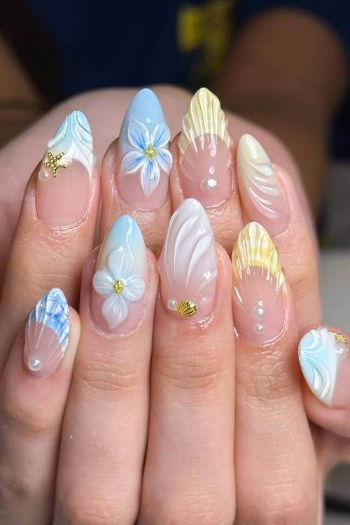 Floral pastel nails with 3D embellishments, spring nail art.