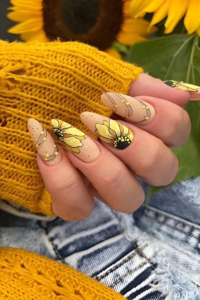 Sunflower nail art on matte earthy base, floral and earthy.