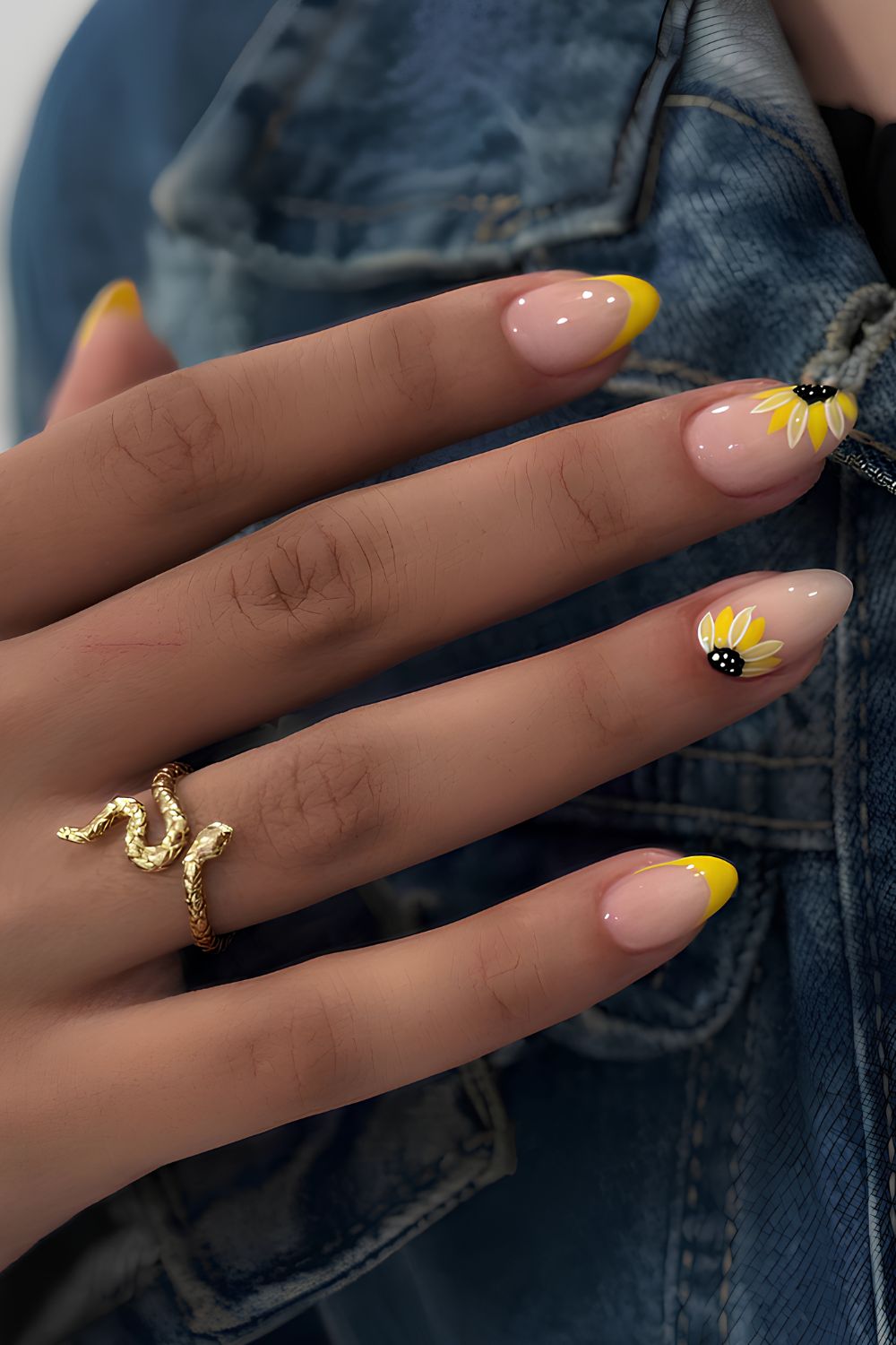 Yellow French tips with daisy nail art.